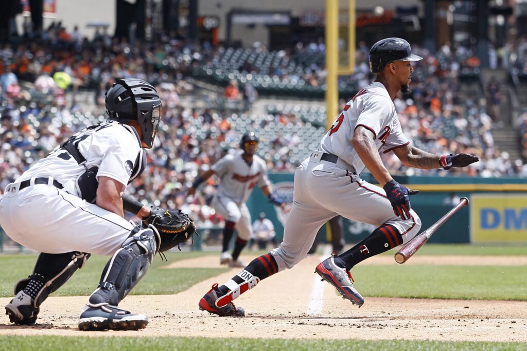 Byron Buxton sprinting from home plate in dynamic baseball wallpaper showcasing speed and skill