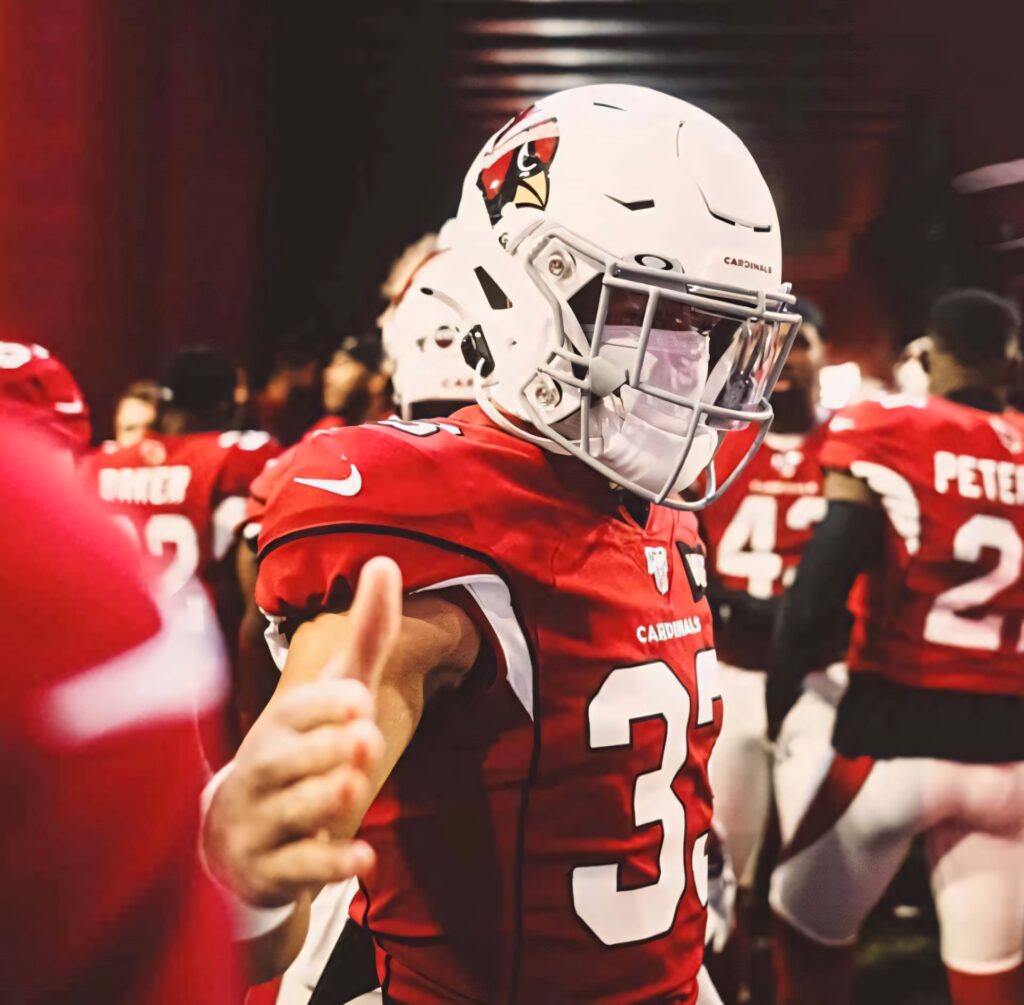 Byron Murphy in Arizona Cardinals uniform mid-action high energy NFL game day wallpaper background