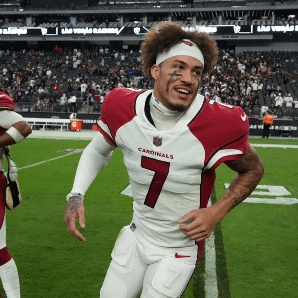 Byron Murphy in Arizona Cardinals uniform celebrating on football field with crowd background Wallpaper