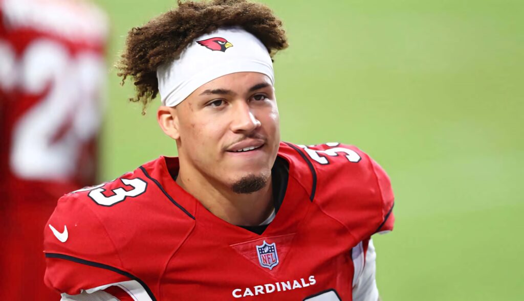 Byron Murphy in Arizona Cardinals uniform vibrant red and white focused football action wallpaper