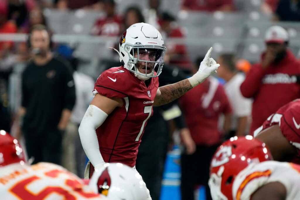 Byron Murphy Arizona Cardinals cornerback in red white uniform focused mid-action on football field Wallpaper