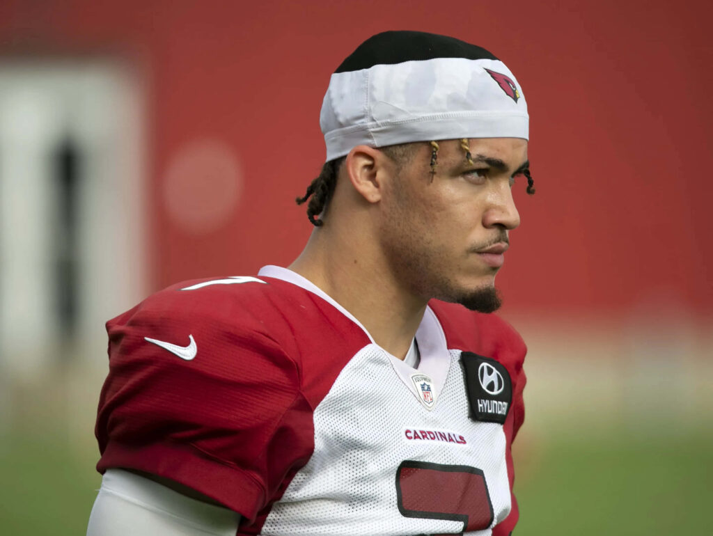 Byron Murphy in Arizona Cardinals jersey focused during game with red stadium background wallpaper
