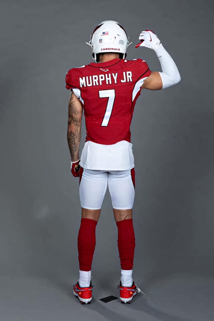 Byron Murphy Jr in red Arizona Cardinals uniform viewed from behind on gray background wallpaper