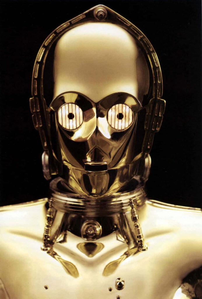 Close-up portrait of C-3PO Star Wars protocol droid gold metallic finish sci-fi wallpaper background