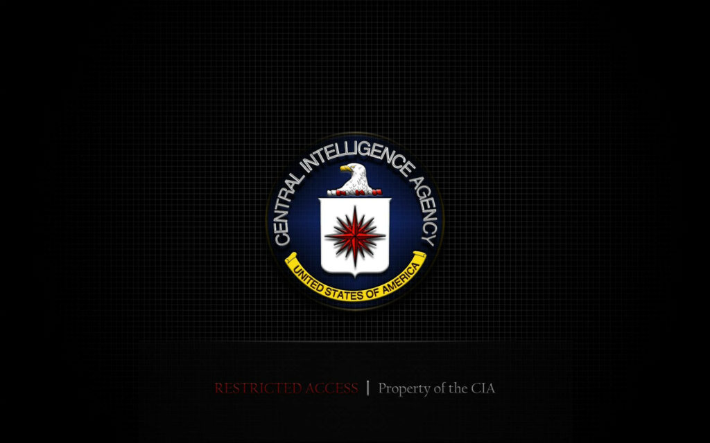CIA logo wallpaper with eagle shield and red compass star on dark grid background emphasizing secrecy