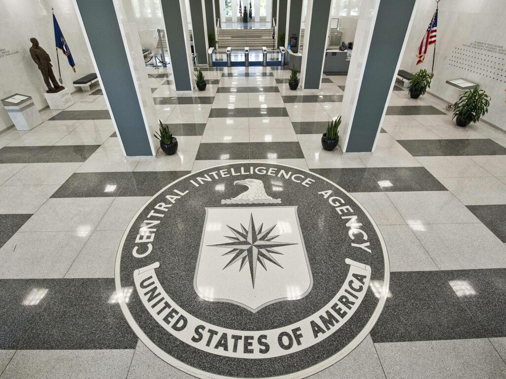 CIA logo on polished marble floor in government building symbolizing intelligence and security Wallpaper