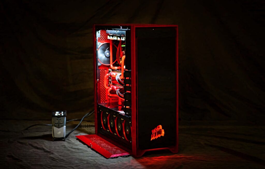 High performance CORSAIR gaming PC with red orange LED lights and advanced cooling systems Wallpaper
