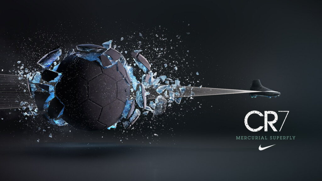 Nike CR7 Mercurial Superfly black football boot striking ball with blue shattering effect wallpaper