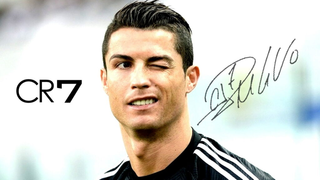 Cristiano Ronaldo winking in black kit with CR7 logo and autograph minimalist wallpaper background