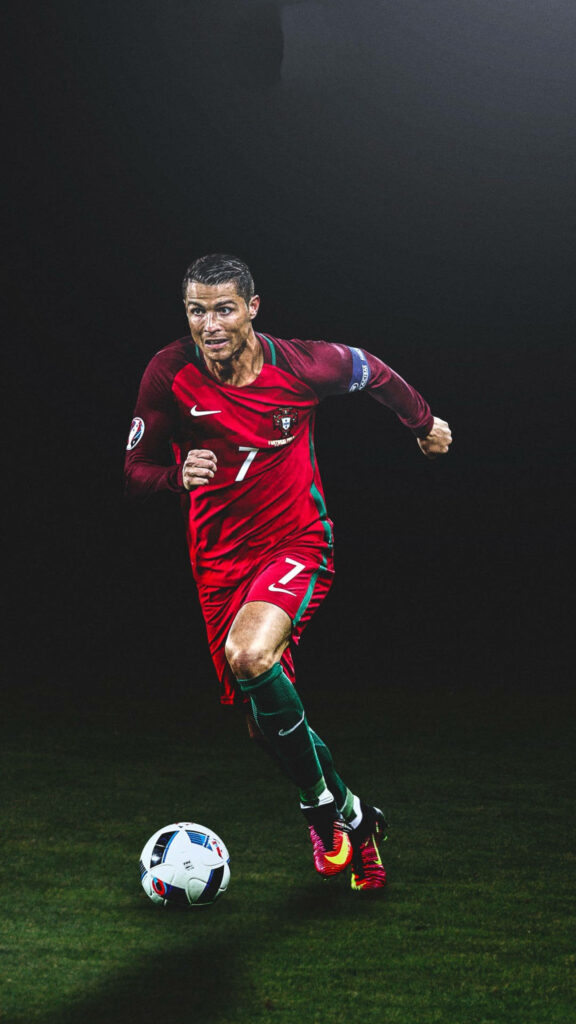 CR7 in Action: Dynamic Portugal Jersey Wallpaper Background