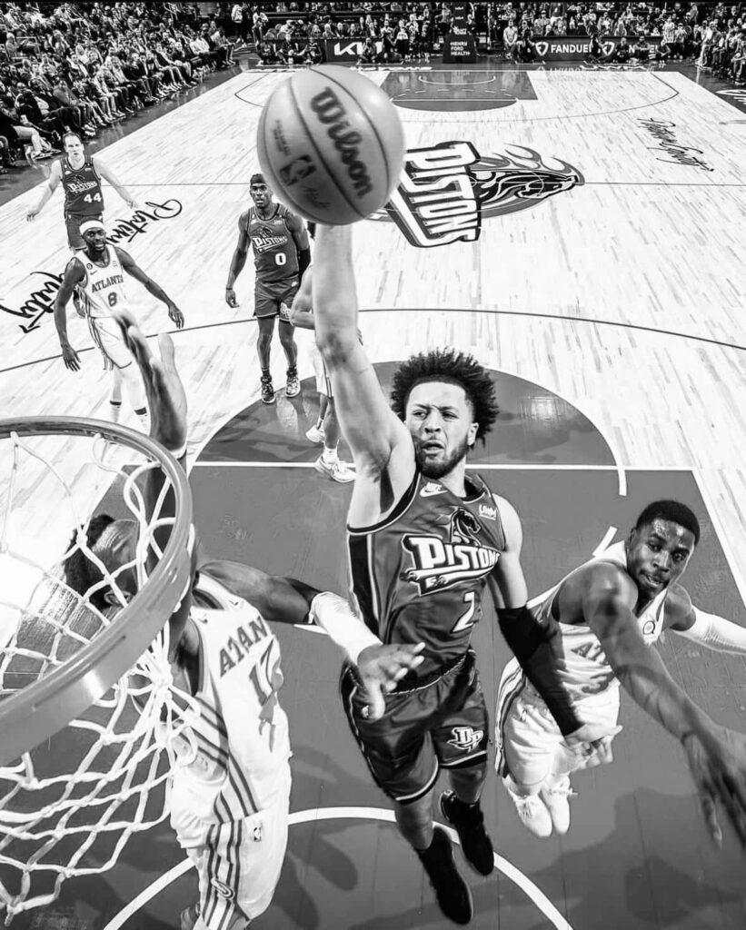 Cade Cunningham mid-air powerful dunk black and white basketball wallpaper intense game