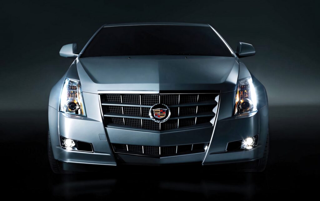 Front view of silver Cadillac CTS Coupe with bold grille sharp headlights and sleek design Wallpaper