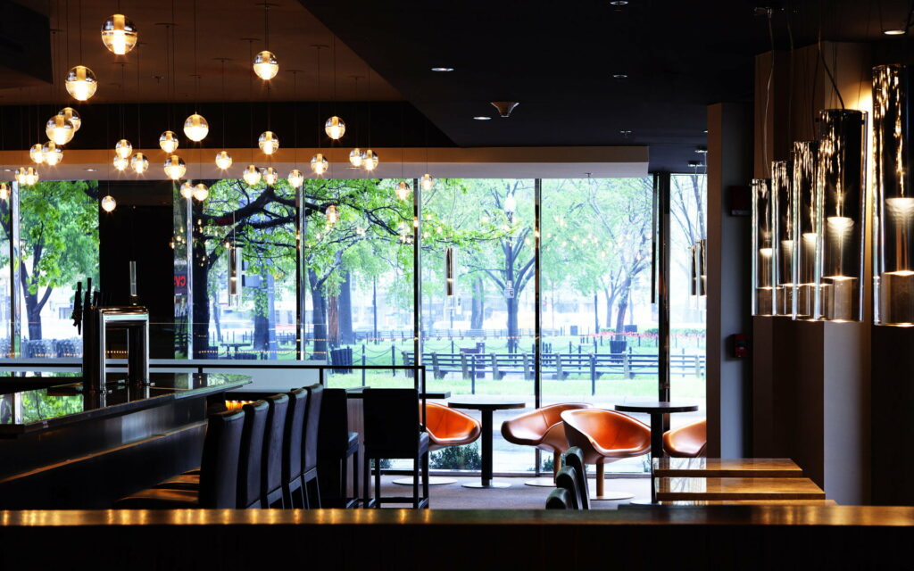 Elevated Dining Experience: Mesmerizing View and Chic Interiors at a Café Wallpaper