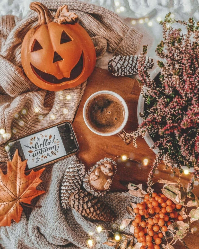 Festive Fall Delights: A Charming Autumn-inspired Composition with Coffee, Jack-o'-lanterns, and Cozy Accents Wallpaper