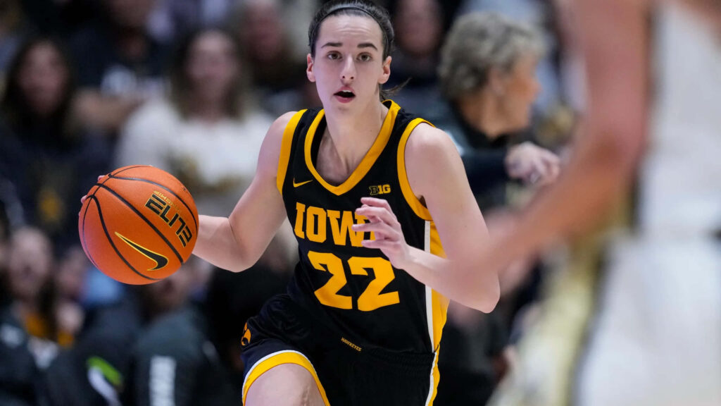 Caitlin Clark Iowa basketball dribbling intense action black gold uniform high resolution wallpaper