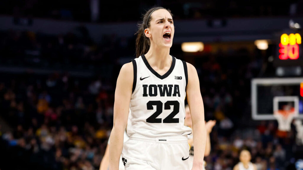 Caitlin Clark in Iowa basketball uniform shows intense focus and passion during college game Wallpaper
