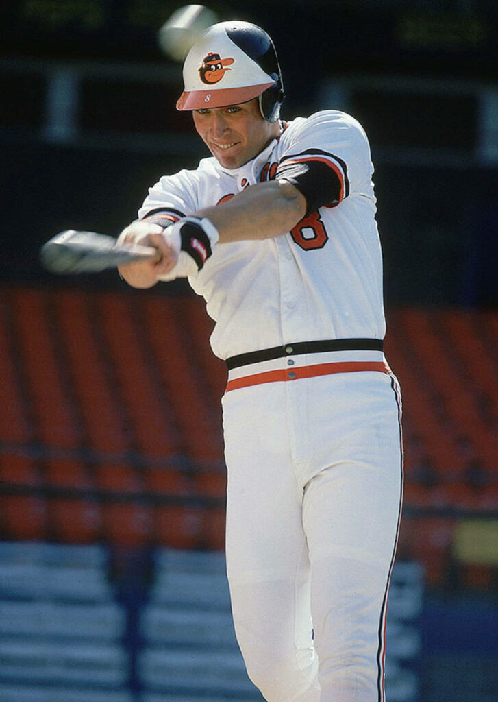 Cal Ripken Jr mid-swing Baltimore Orioles uniform stadium background baseball action wallpaper