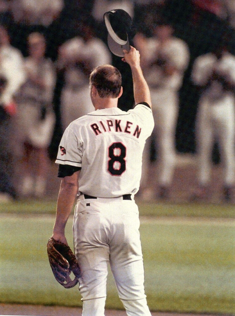 Cal Ripken Jr Orioles jersey number eight raising cap tribute legacy baseball wallpaper background