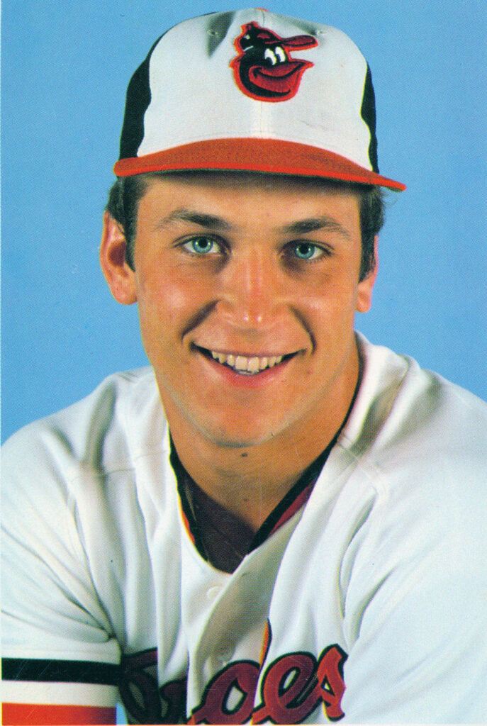 Cal Ripken Jr rookie portrait in Orioles uniform blue background iconic baseball wallpaper