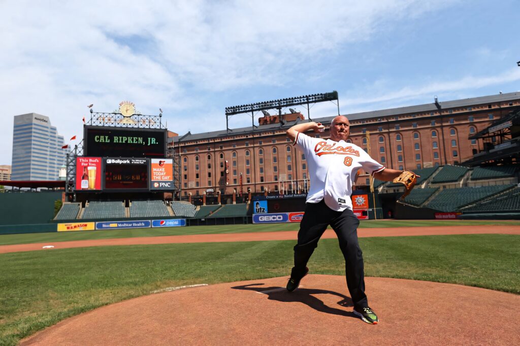 Cal Ripken Jr throwing pitch at Camden Yards Orioles jersey scoreboard daylight baseball wallpaper