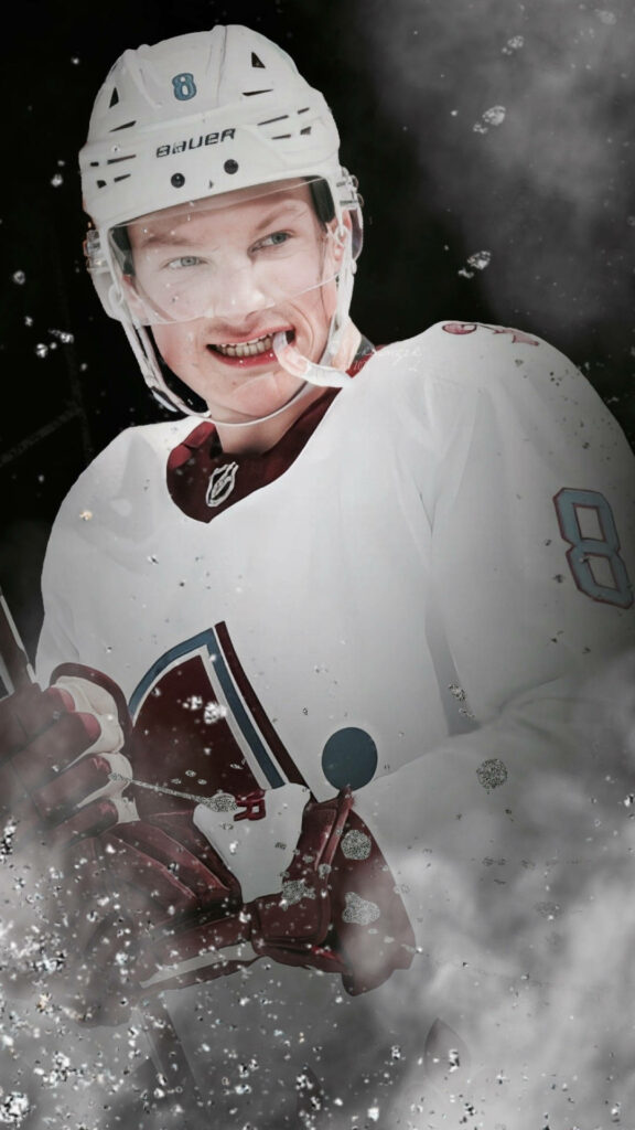 Cale Makar intense hockey action wallpaper icy background snow dynamic energy white uniform