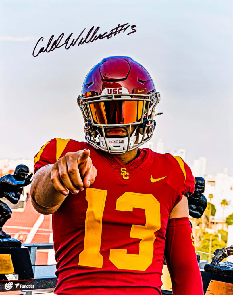 Caleb Williams USC quarterback in red gold uniform pointing confidently with autograph wallpaper