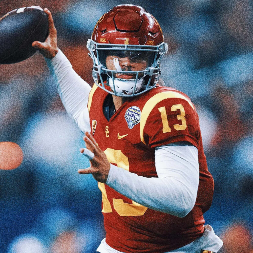 Caleb Williams USC Trojans quarterback mid-pass in red gold uniform showing athleticism and focus Wallpaper