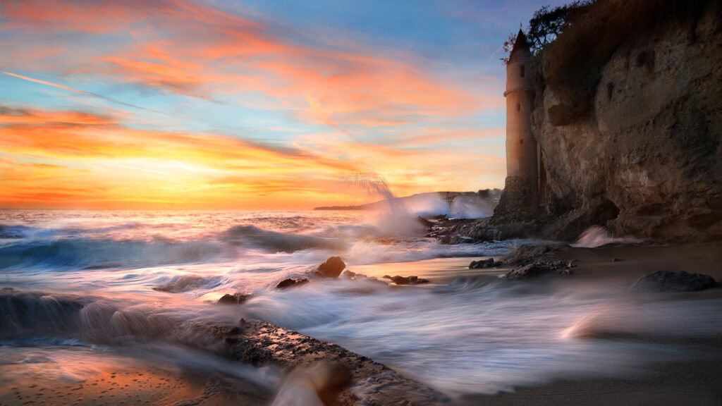 California Dreamin': A Breathtaking HD Wallpaper of a Coastline Sunset with Vibrant Sky, Majestic Waves, and Serene Horizon as Nature's Perfect Backdrop