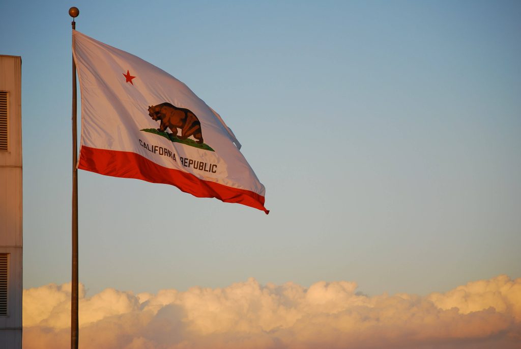 California Republic flag waving at sunset golden hour sky patriotic desktop wallpaper background
