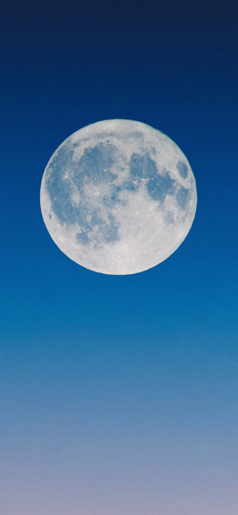 Luminous Full Moon iPhone Wallpaper: Serene Gradient Blue Sky