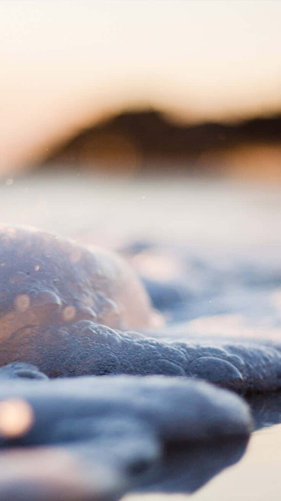 Calming Beach Wallpaper: Soft Focus Ocean Waves in Golden Light