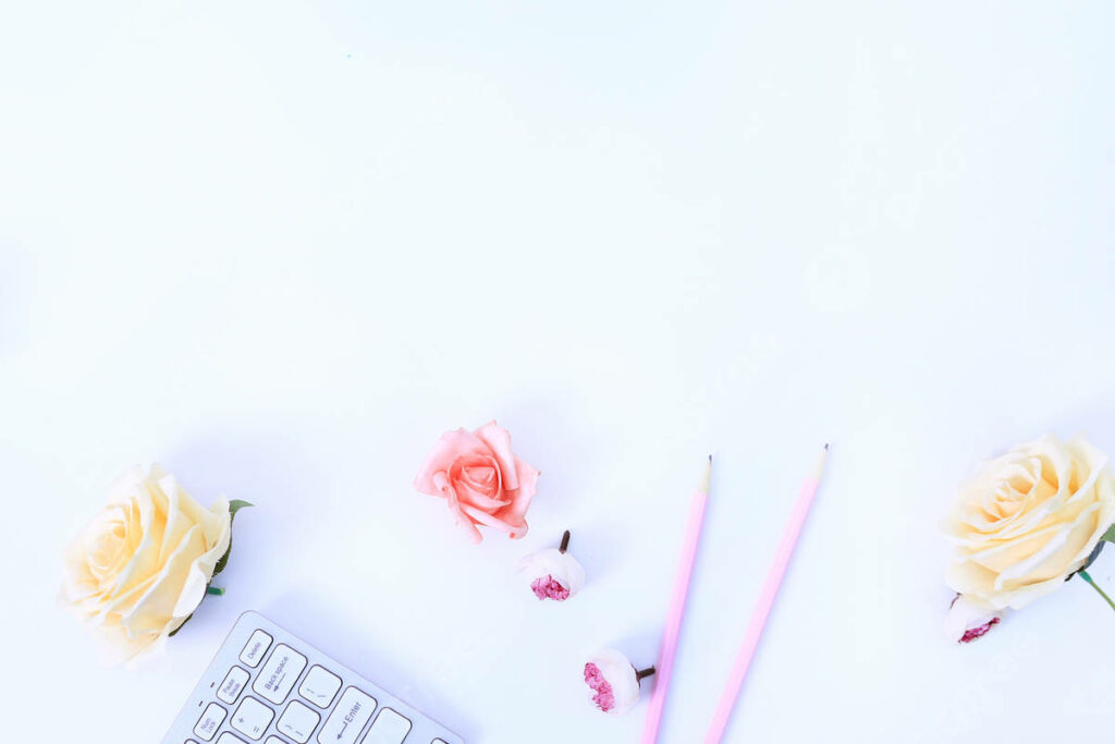 Serene Minimalist Workspace Wallpaper with Soft Hues & Flowers