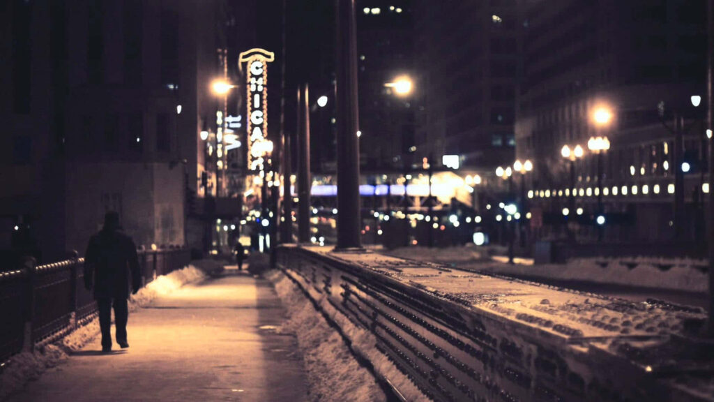 Calm Night Walk: Urban Sidewalk Wallpaper with Illuminated Signs