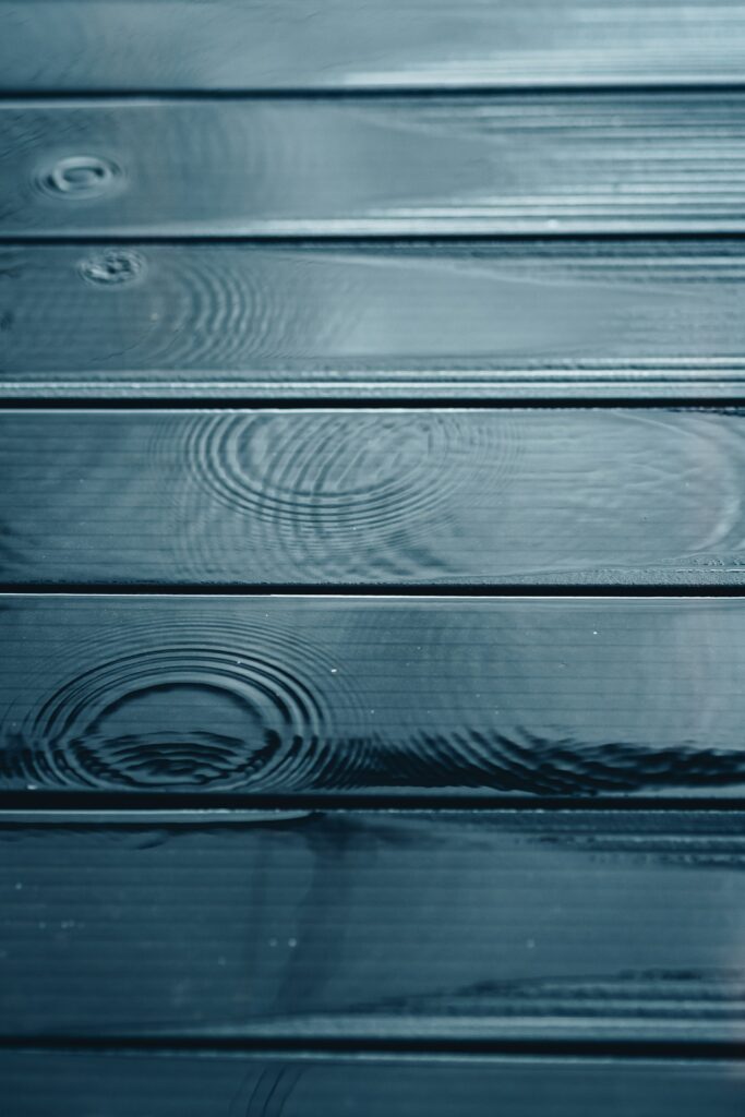 Calming Macro Wallpaper: Water Droplets on Dark Wood Boards