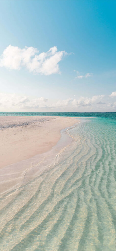 Serene Beach Scene: Soft White Sand & Turquoise Waters Wallpaper