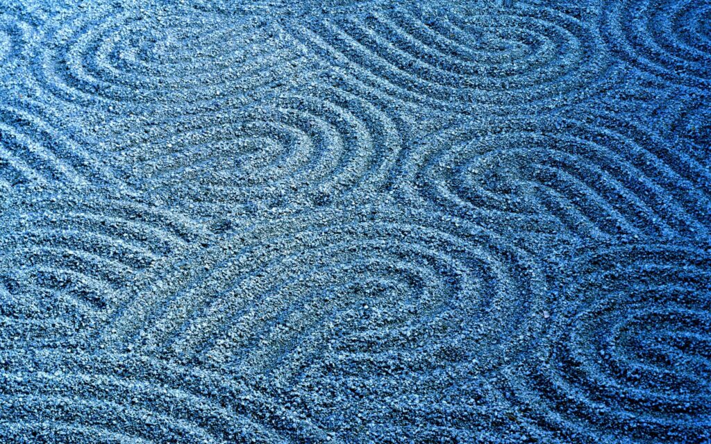 Calming Blue Wallpaper with Intricate Circular Sand Patterns