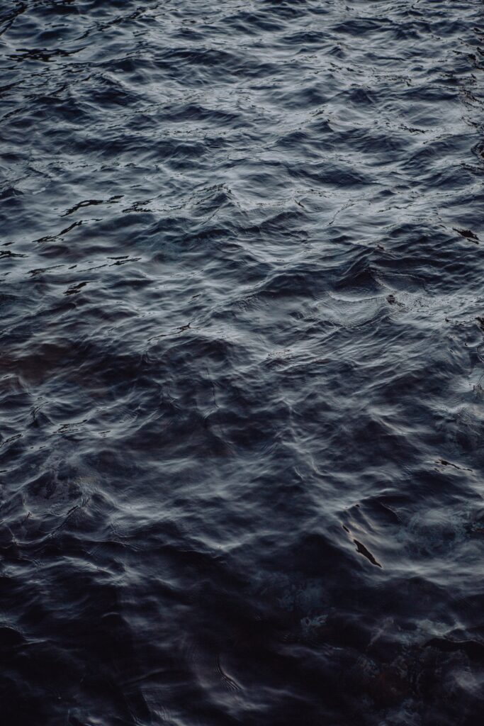 Serene wallpaper with soft blue gray water waves and ripples creating a calming background