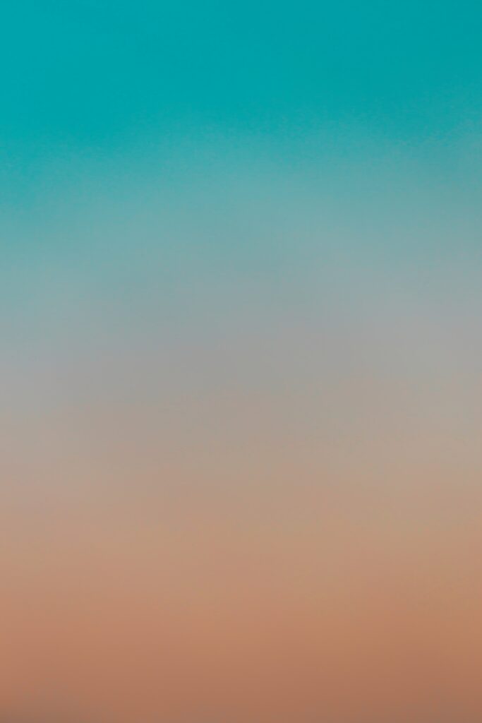 Soft blue and pink gradient wallpaper evoking serene dusk sky with dreamy tranquil background