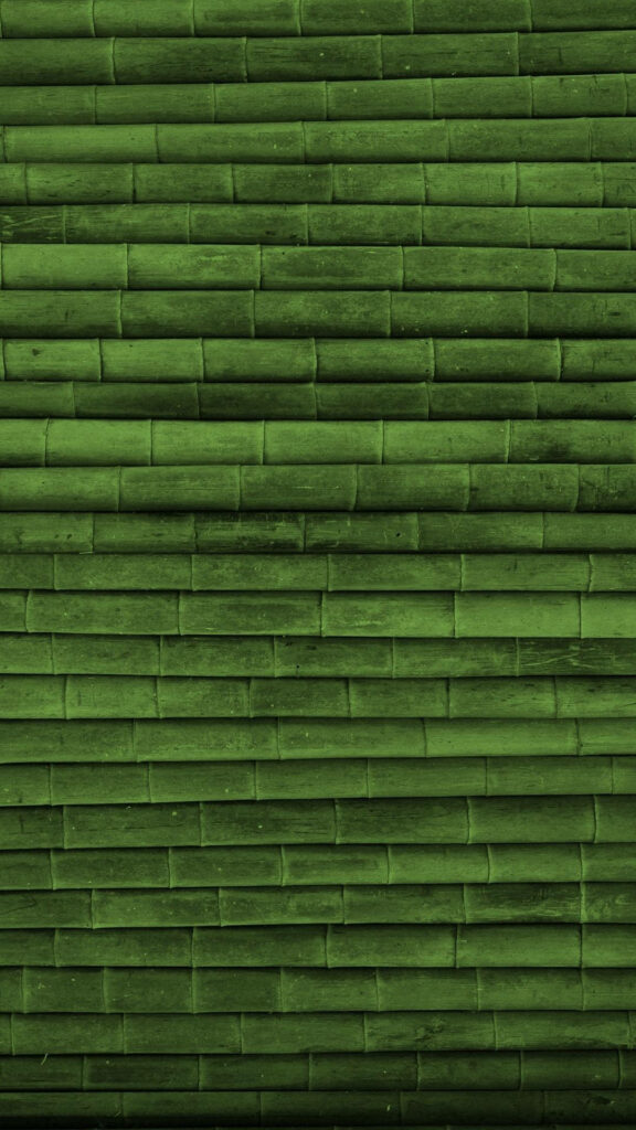 Serene iPhone wallpaper with neatly stacked green bamboo stalks natural calming texture background
