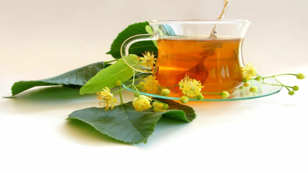 Calming Wallpaper: Glass Cup of Linden Tea with Fresh Flowers