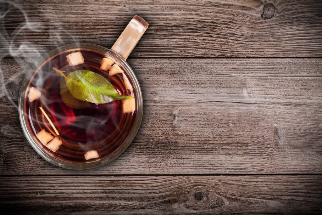 Calming Top-View Wallpaper: Hot Tea with Fruit on Rustic Table