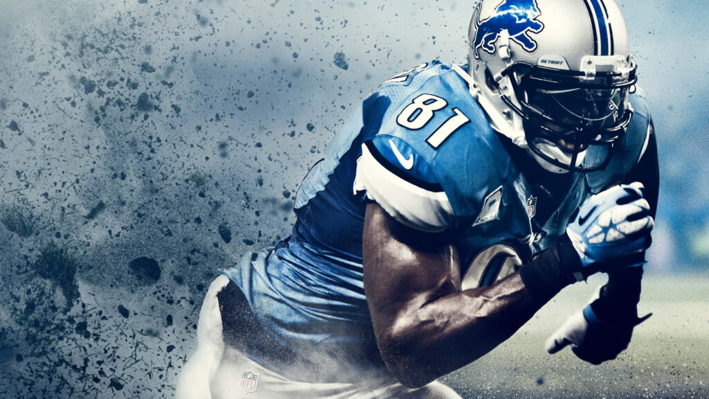 Calvin Johnson Detroit Lions wide receiver in blue silver uniform dynamic action wallpaper