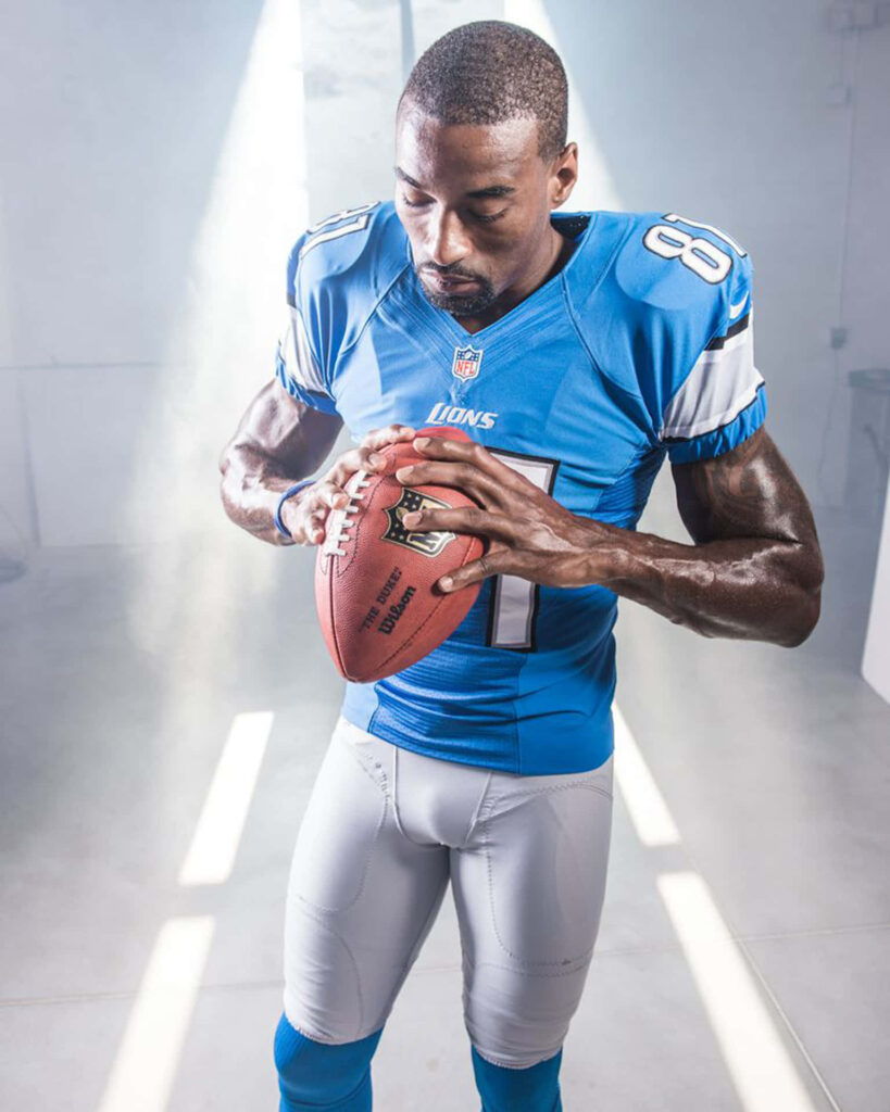 Calvin Johnson Detroit Lions wide receiver holding football in blue silver uniform high definition Wallpaper