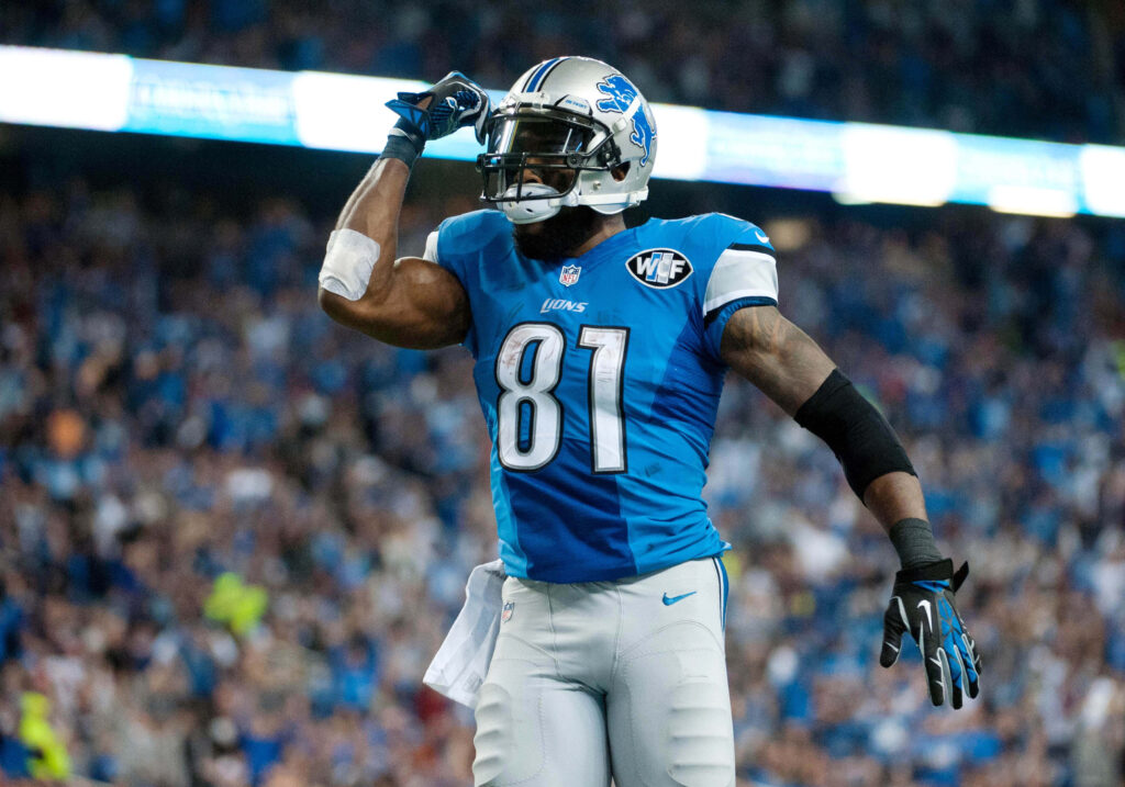 Calvin Johnson Detroit Lions number 81 wide receiver in action NFL game vibrant blue stadium Wallpaper
