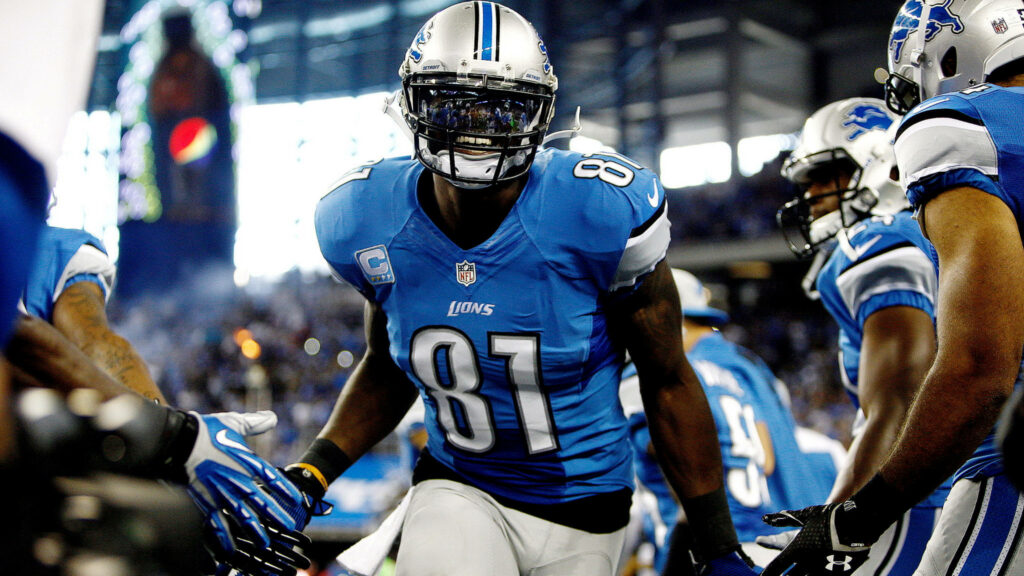 Calvin Johnson Detroit Lions number 81 emerging from tunnel in blue silver uniform game day energy Wallpaper