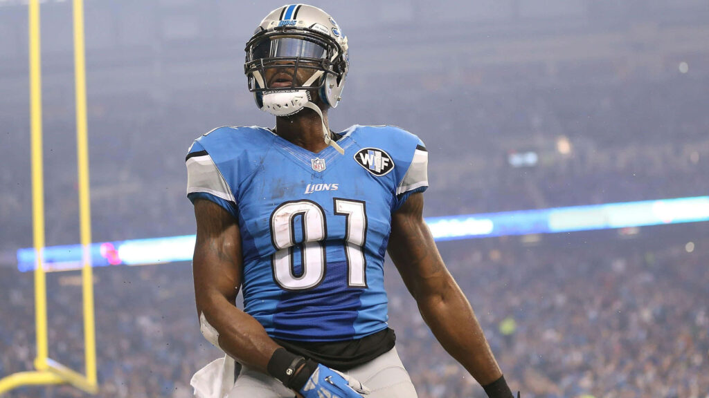 Calvin Johnson Detroit Lions wallpaper in blue silver uniform stadium lights intense focus