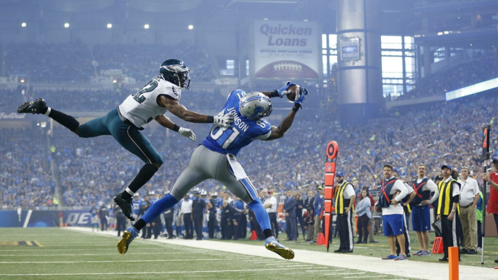 Calvin Johnson Megatron making spectacular catch for Detroit Lions NFL football packed stadium action Wallpaper