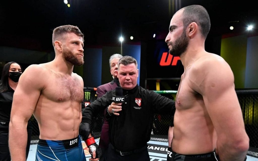 Calvin Kattar and Giga Chikadze intense UFC face off in Octagon pre-match high-definition wallpaper