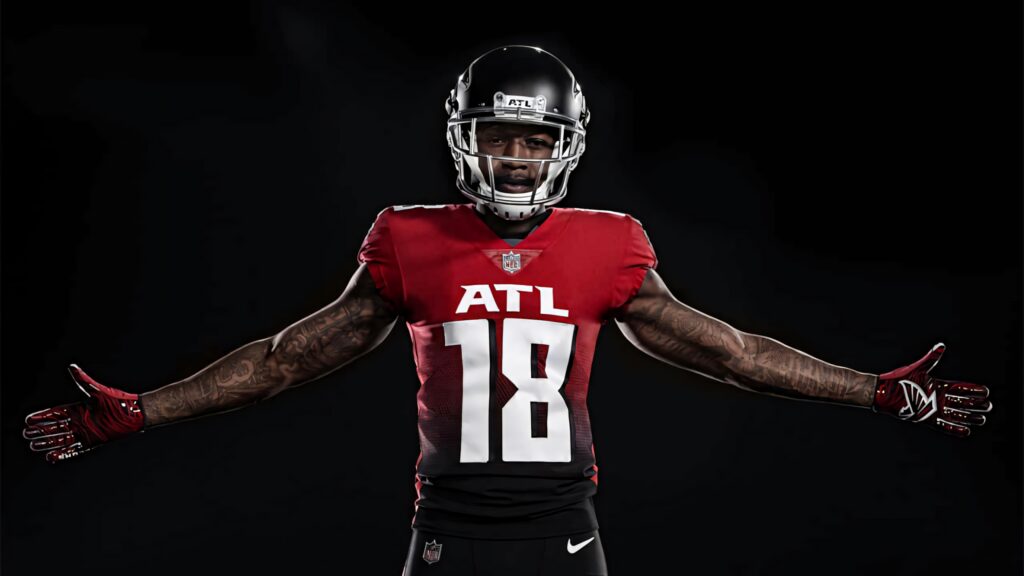Calvin Ridley Atlanta Falcons number 18 in red black uniform powerful pose dark background Wallpaper