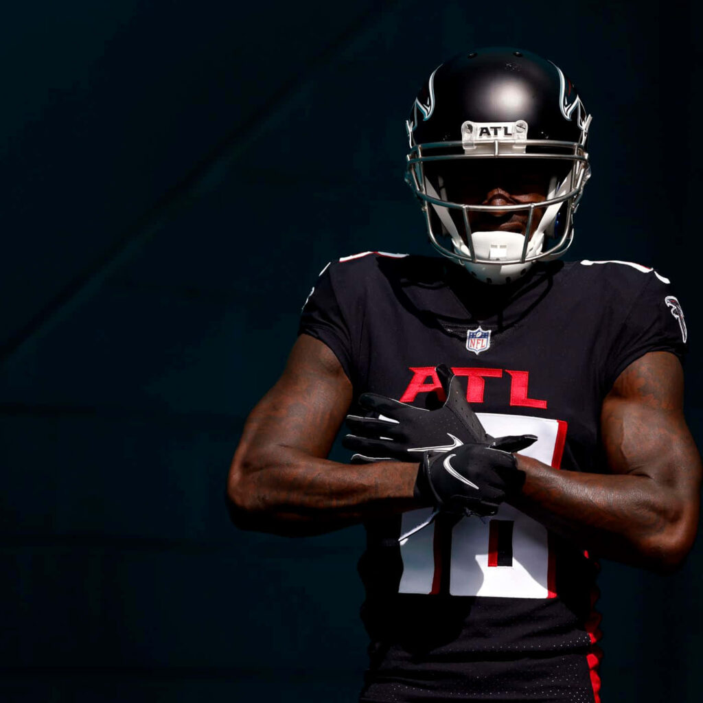 Calvin Ridley Atlanta Falcons dynamic wallpaper bold black red white uniform athletic pose